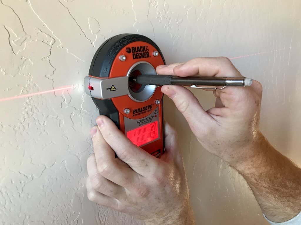 Master the Art of Hanging with a Stud Finder and Laser Level Combo